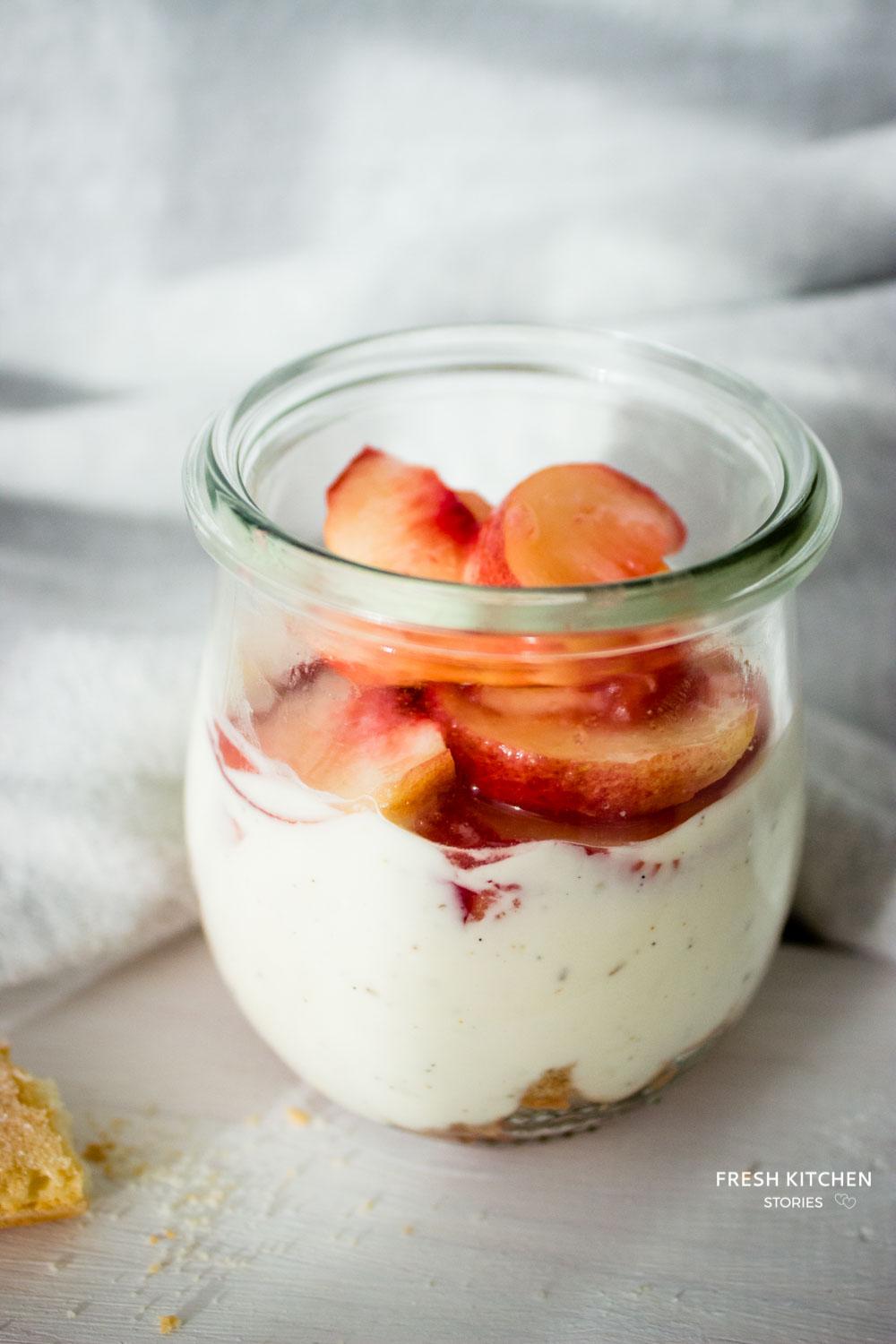 Healthy greek yogurt tiramisu topped with peaches