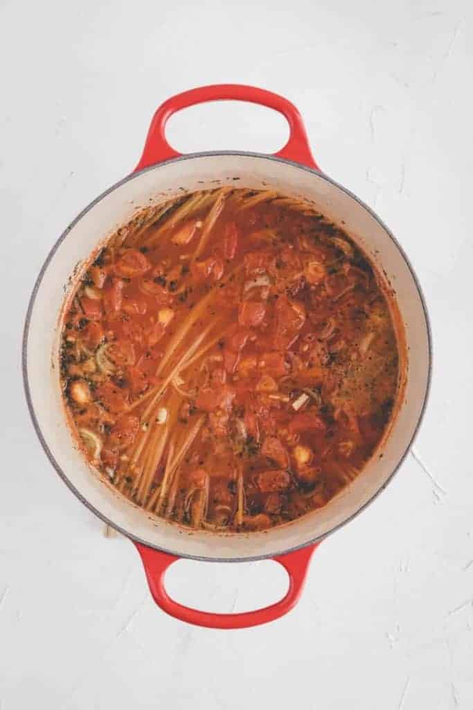 one pot pasta cooking in a red pot