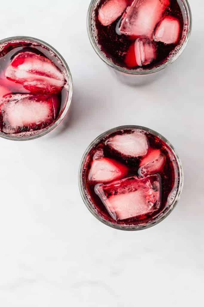 agua de jamaica served over ice in glasses