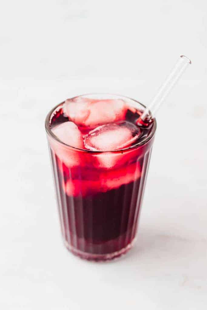 hibiscus iced tea served with ice and a straw