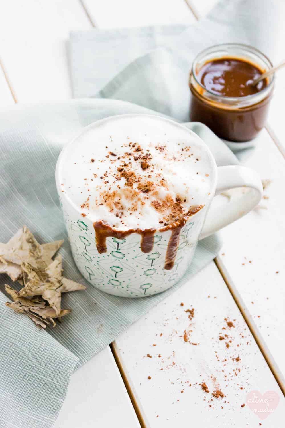 Nutella Cappuccino in a mug topped with milk foam and Nutella