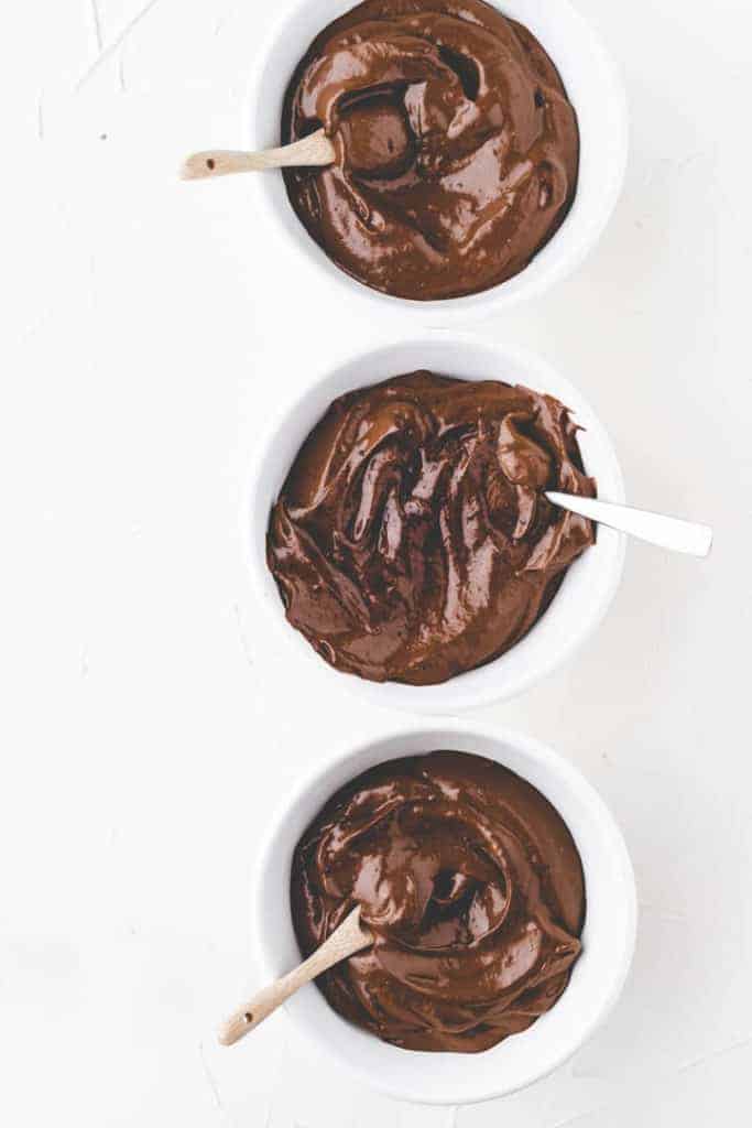 vegan avocado chocolate mousse in white bowls