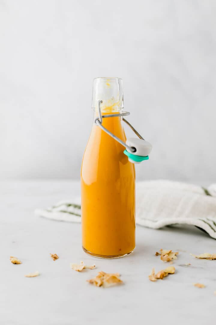 ginger shot recipe filled in a glass bottle