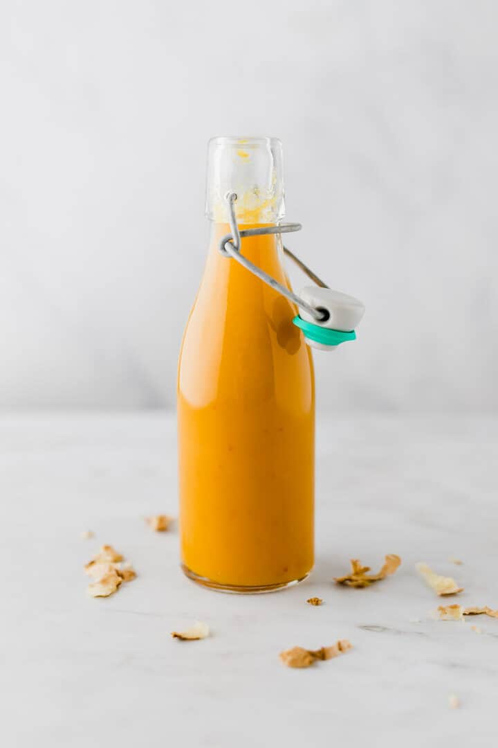 ginger turmeric shot in a glass bottle