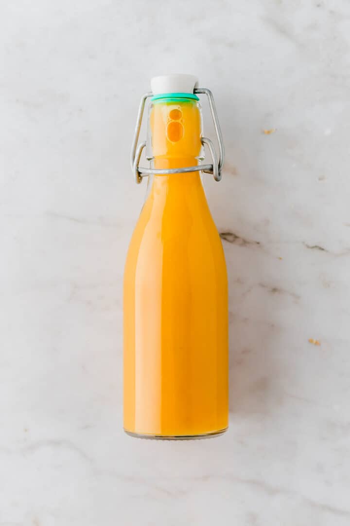 lemon ginger shot in a glass bottle