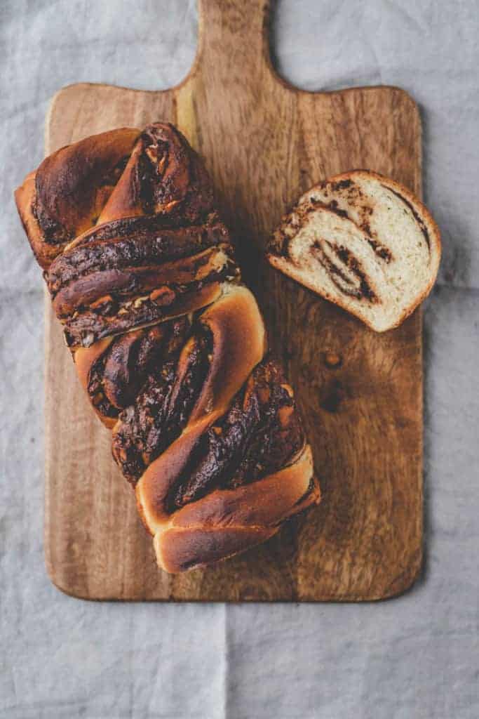 braided nutella bread from top on a wooden board