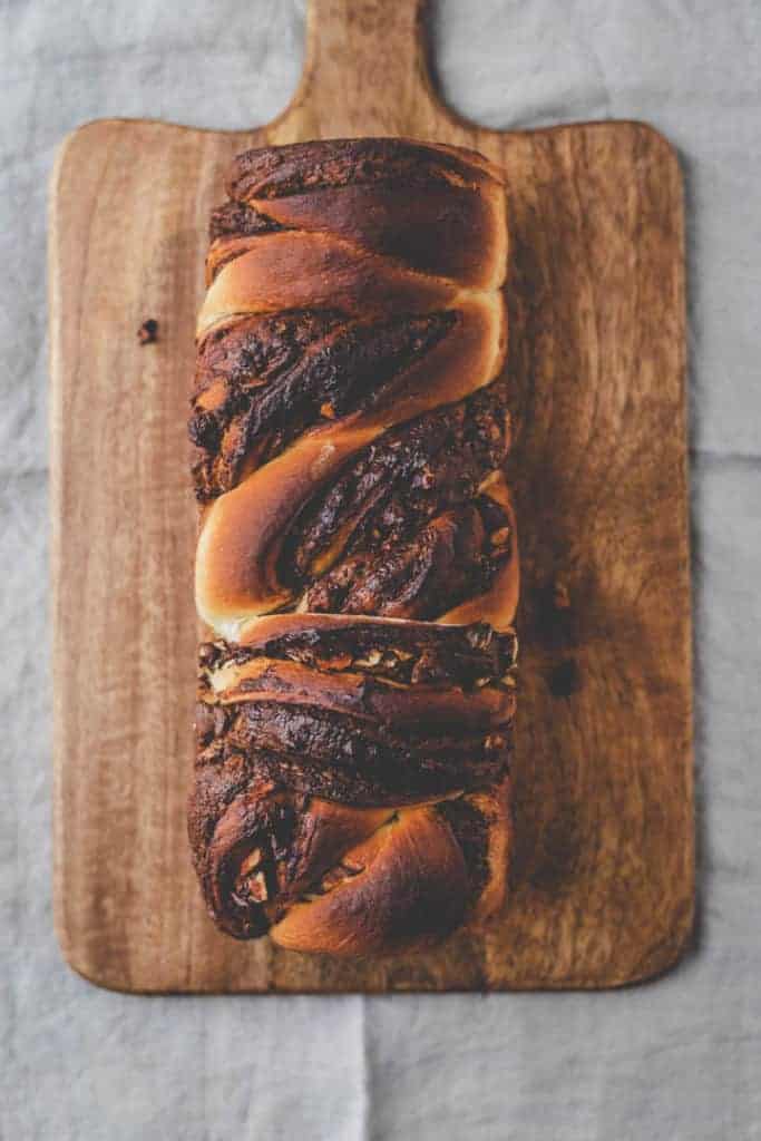 braided nutella bread from top on a wooden board