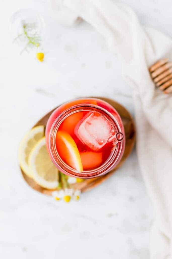 homemade iced tea served with ice cubes and lemon