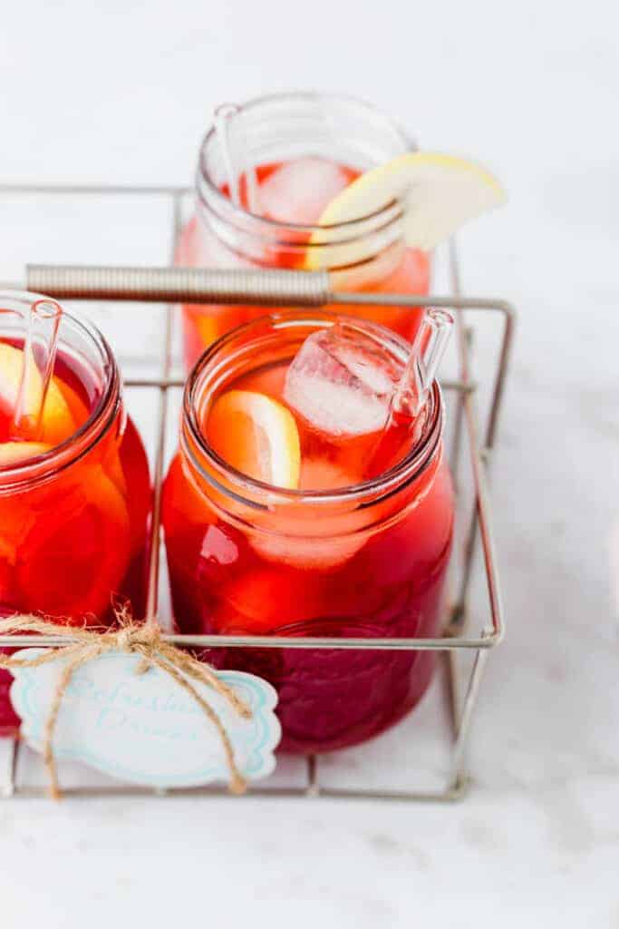 iced tea recipe served in summer glasses with ice and lemon slices