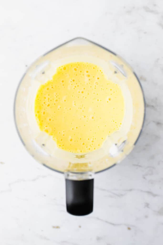 blended vegan mango lassi in a blender