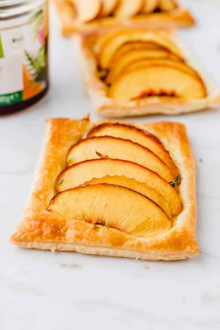 peach tarts on puff pastry