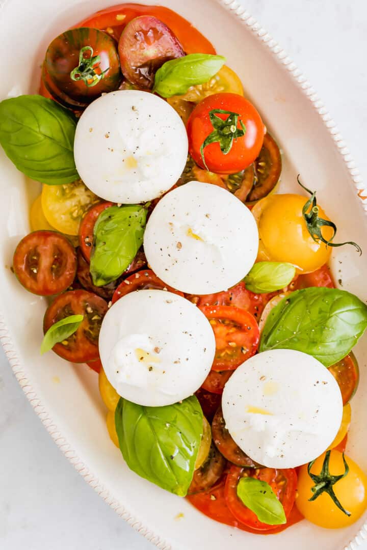 burrata caprese salad heirloom tomato burrata salad on a serving platter