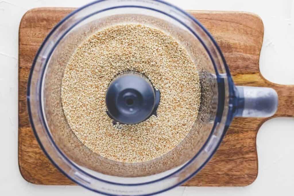 how to make tahini - blend sesame seeds in a food processor
