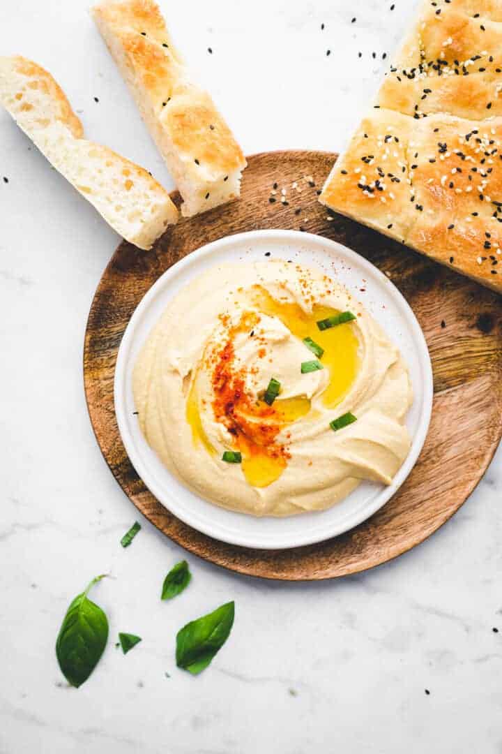 smooth vegan hummus served with pide bread