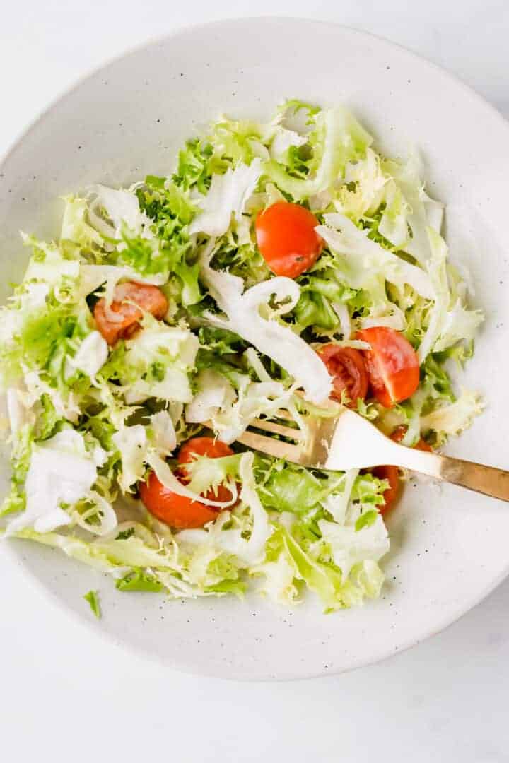 green salad with vegan salad dressing