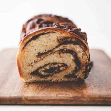 braided nutella bread on a dark wooden board