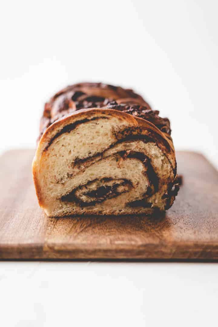 braided nutella bread on a dark wooden board