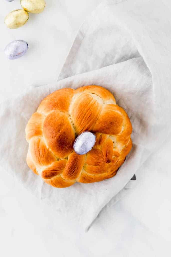 easter bread with three ropes and a easter chocolate egg in the middle