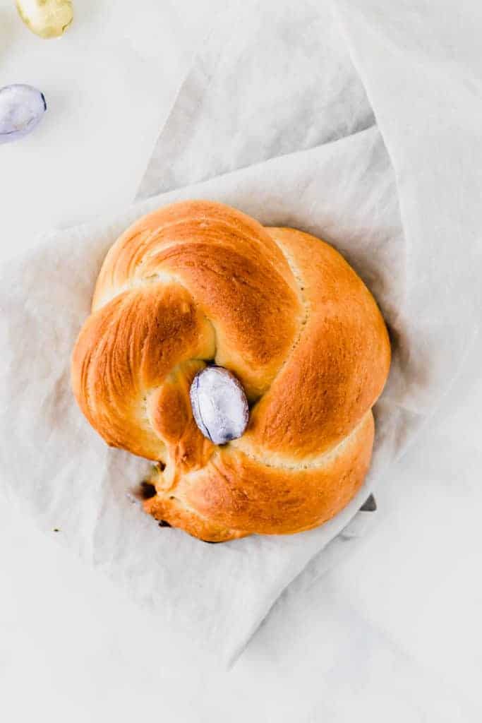 easter bread with two ropes and a easter chocolate egg in the middle