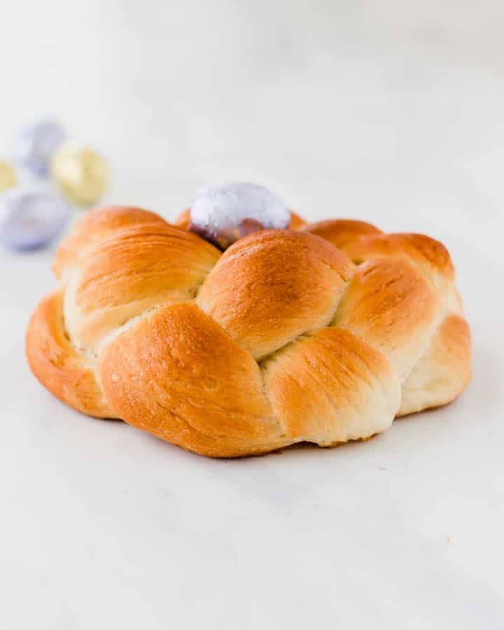 easter bread with three ropes and a easter chocolate egg in the middle