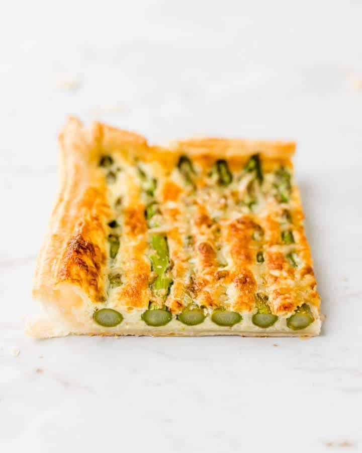 piece of baked asparagus tart puff pastry