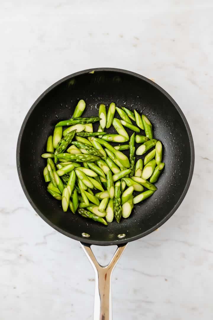 roasted green asparagus in a skillet