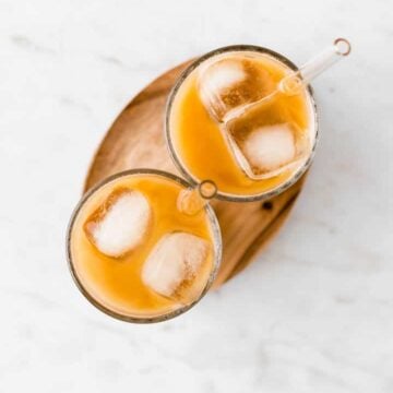 instant iced coffee in two glasses with ice cubes