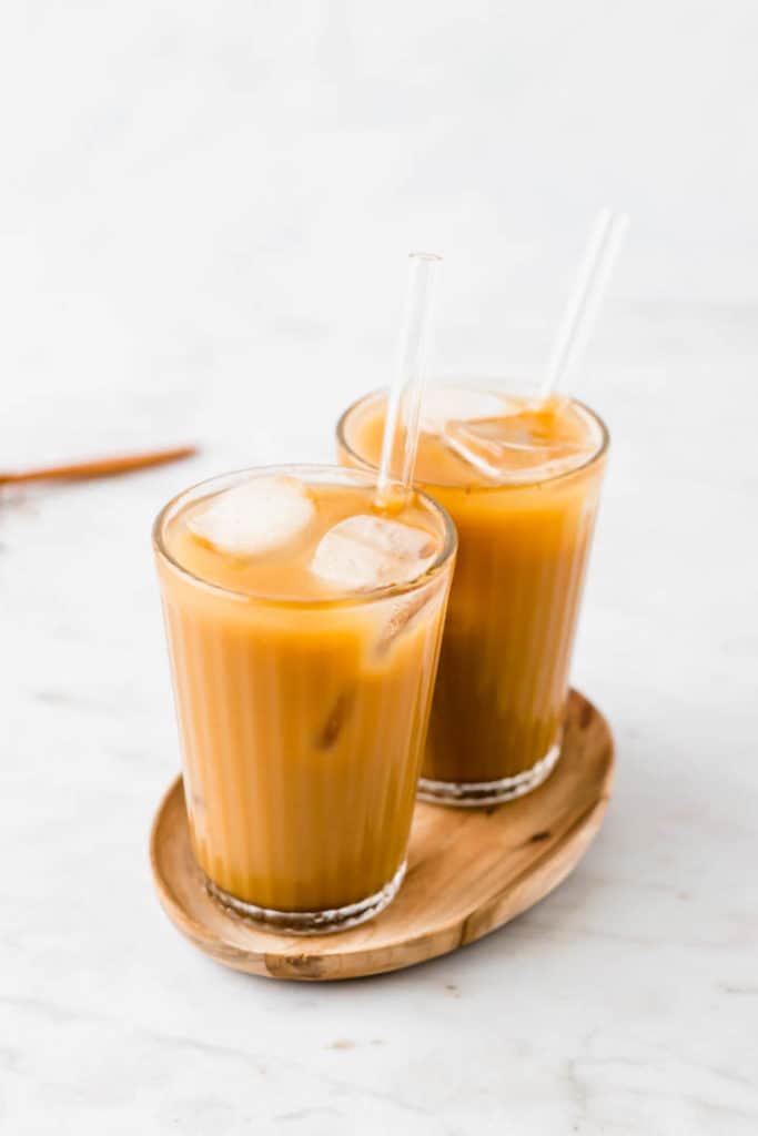 vegan iced coffee in two glasses on a wooden board