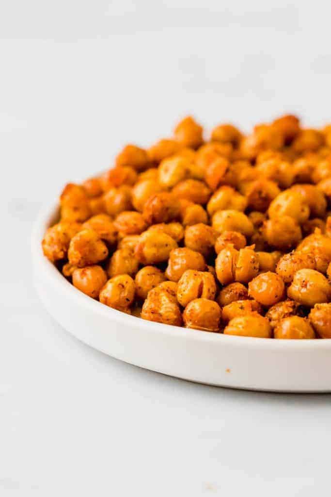 healthy baked chickpeas with spices on a white plate