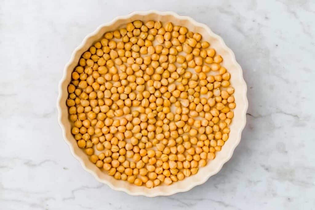 drained chickpeas in a baking dish