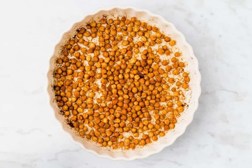 golden brown chickpeas in a baking dish after baking