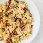 sun dried tomato pasta salad with scallions, pine nuts, and bow tie pasta