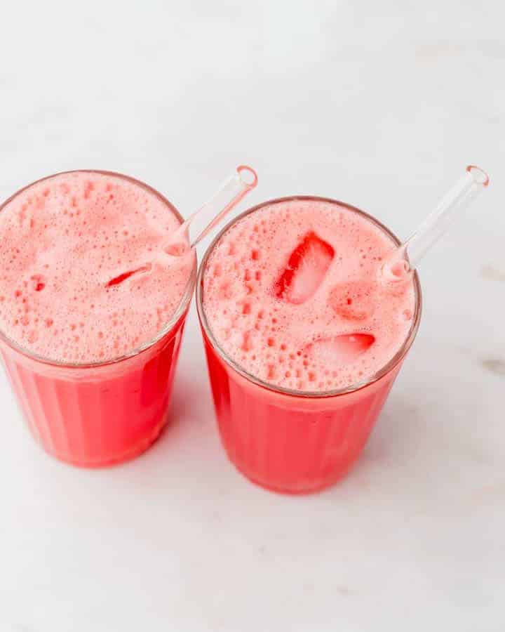 mexican watermelon drink fille in two glasses with ice cubes