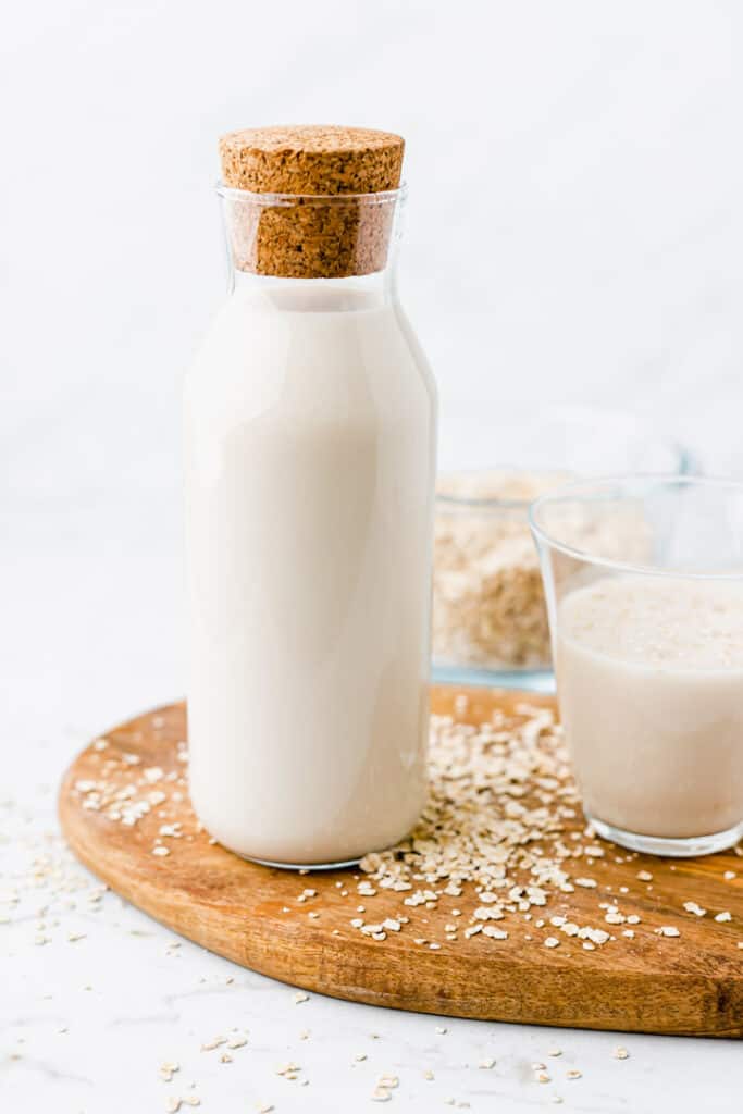 homemade oat milk in a glass bottle