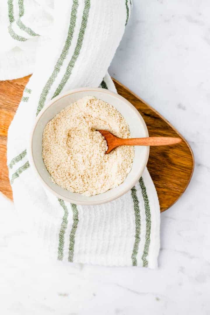 vegan parmesan cheese served in a blue bowl