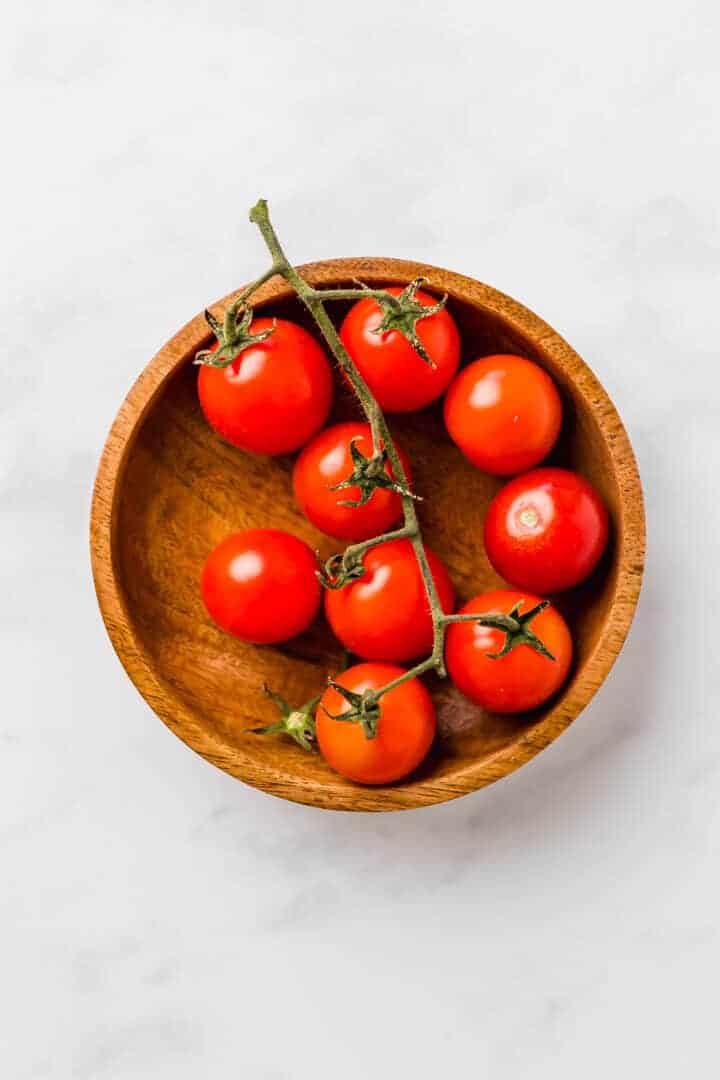 cherry tomatoes in a wooden bowl