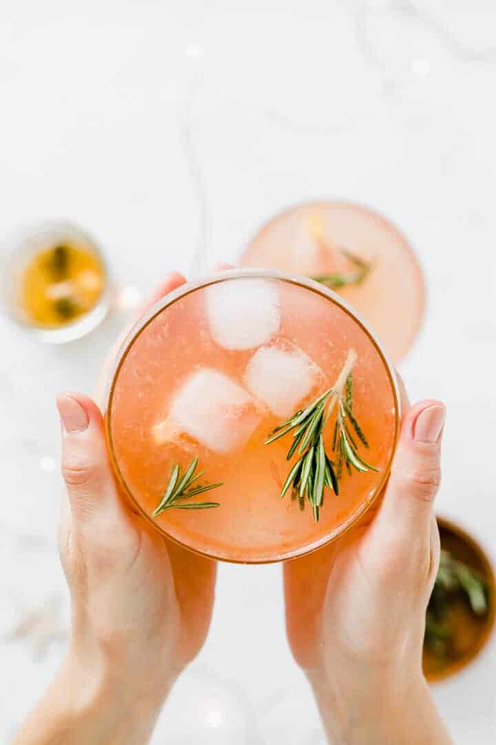 grapefruit mocktail held between two hands