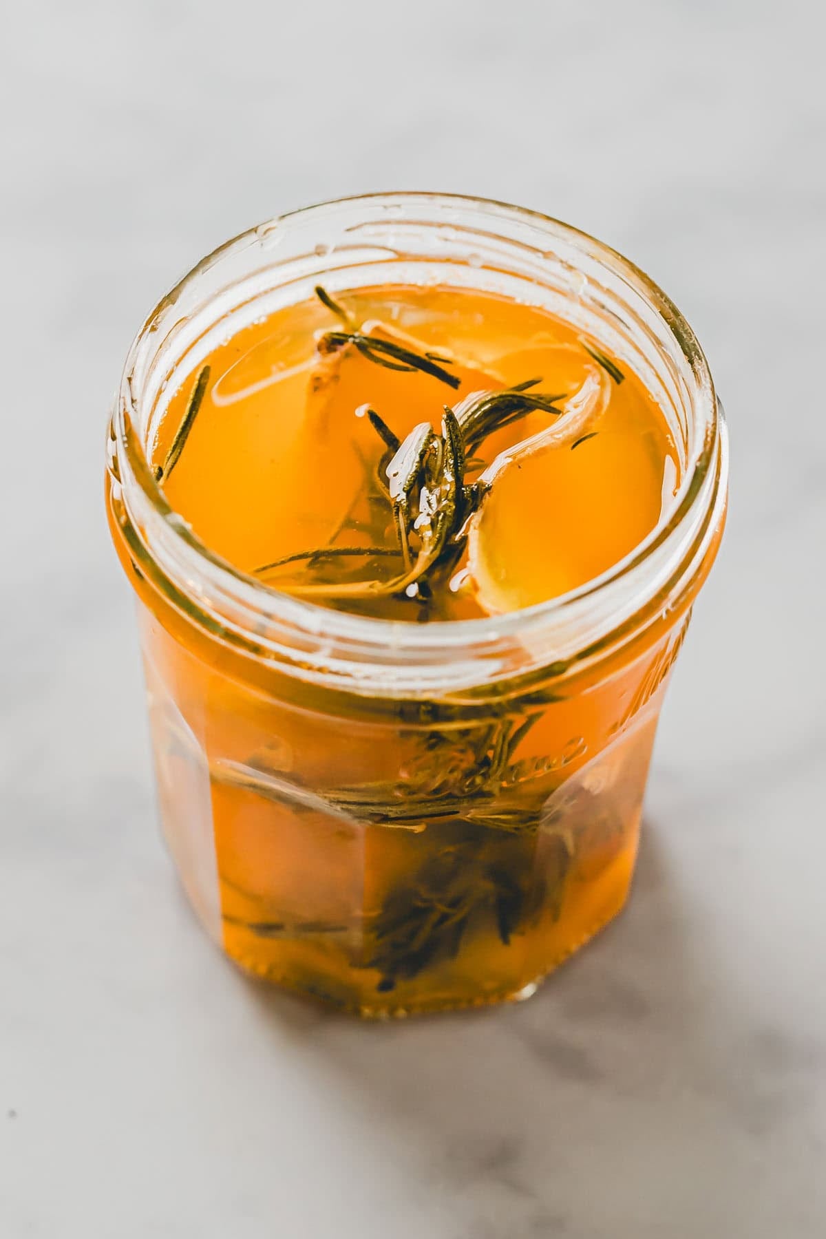 grapefruit rosemary simple syrup in a glass jar
