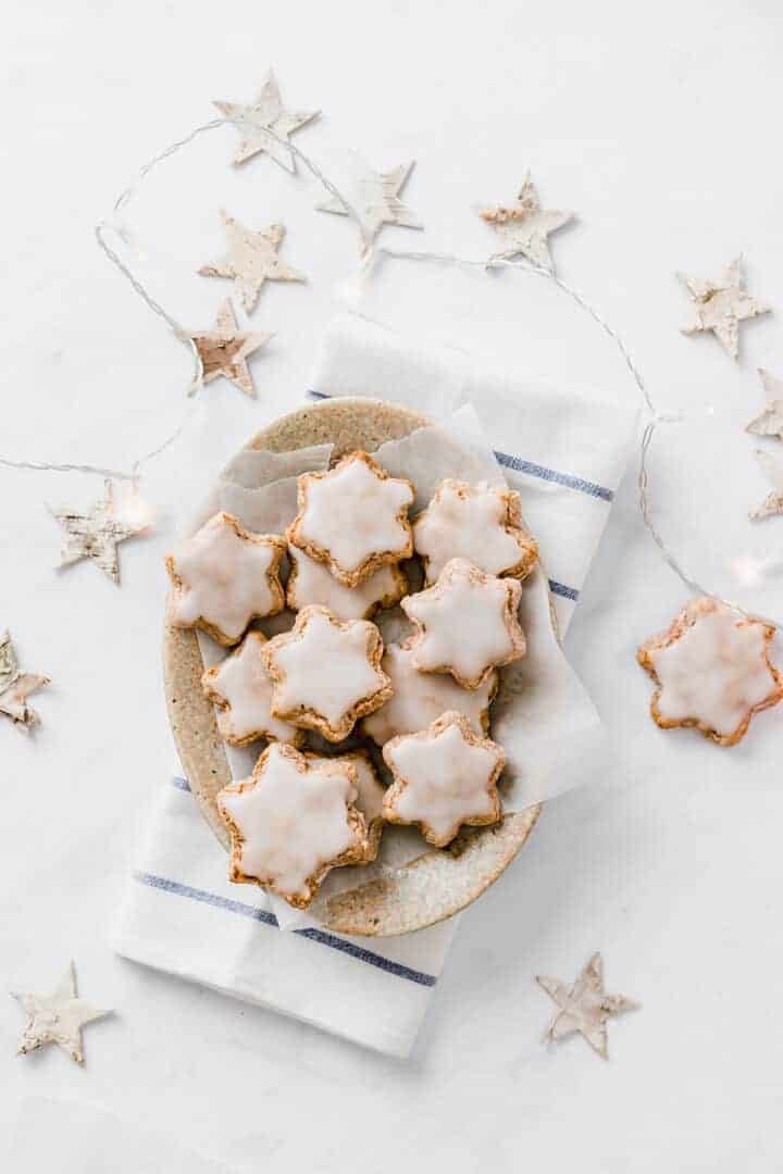 cinnamon cookies in star shape served on a brown plate