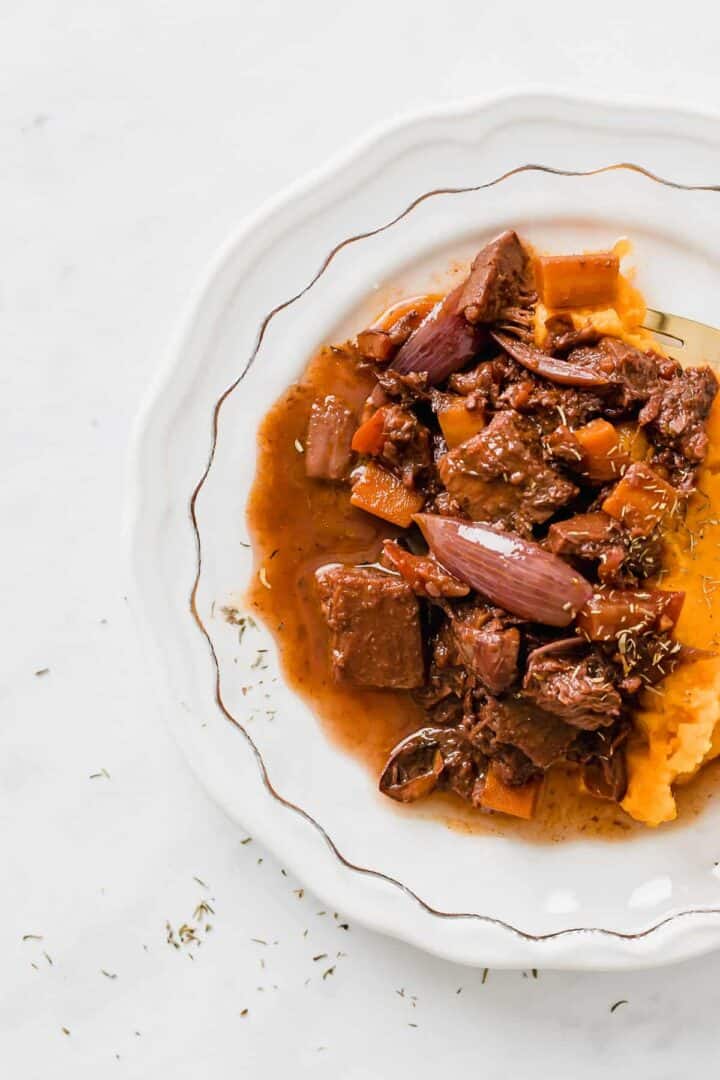 vegan beef stew served on a white plate