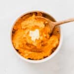 savory mashed sweet potatoes served with a piece of dairy-free margarine