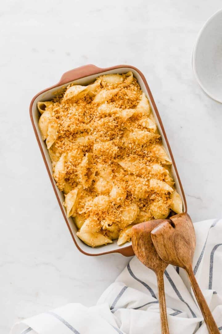 easy vegan mac and cheese with two wooden spoons next to it