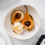 caramelized pears and ice cream served in a small bowl