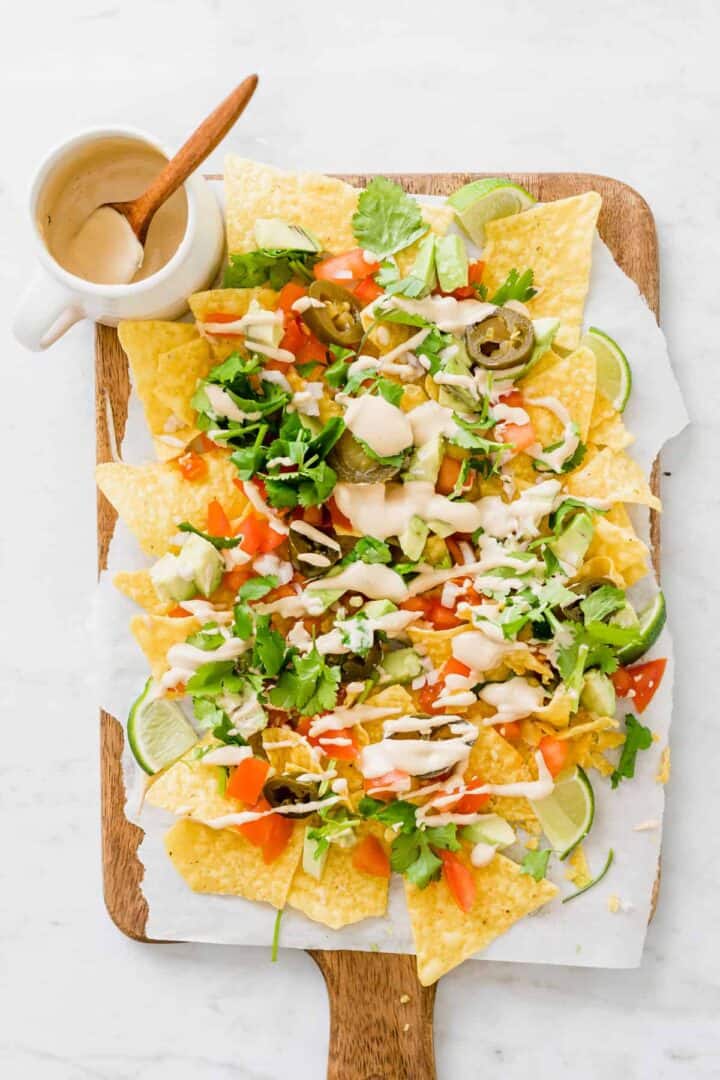 vegan nachos recipe served on a wooden plate