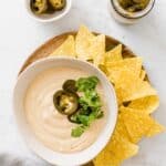 vegan queso served with nachos