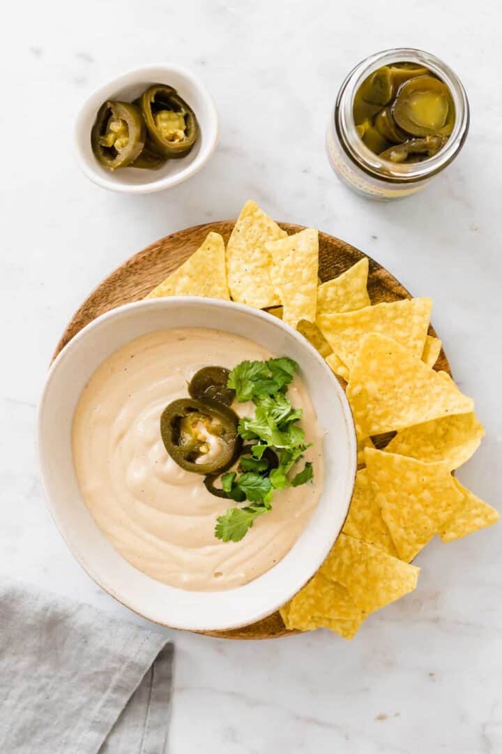 vegan queso served with nachos