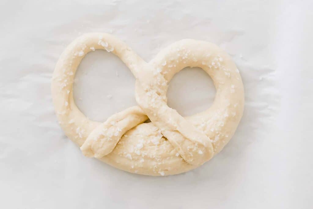 raw pretzel dough sprinkled with sea salt