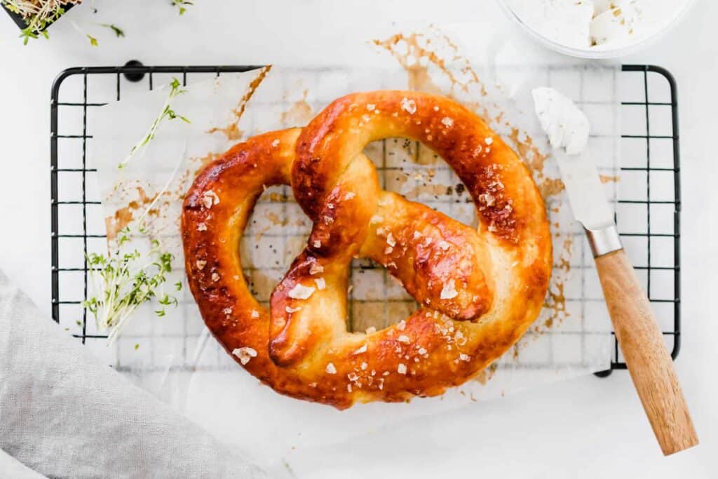 soft pretzel on a black cooling rack