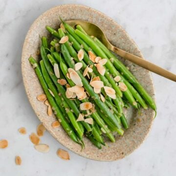 green beans almondine served on a plate