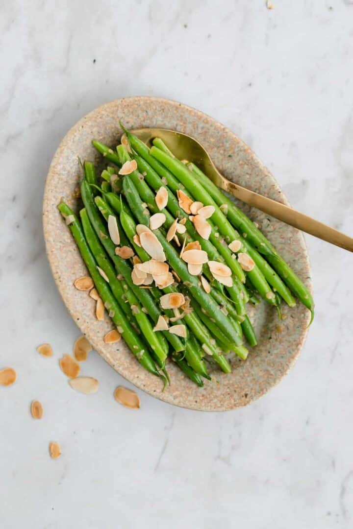 green beans almondine served on a plate